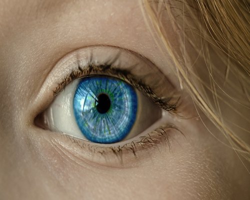 Person looking away from laptop to rest their eyes